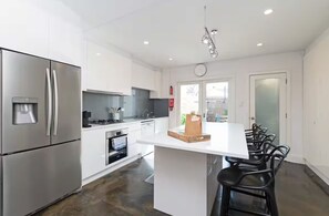 City House, Patio | Private kitchen - Lovely & Spacious 2-BR home in Norwood (Norwood)
