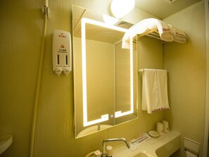 A bathroom with a mirror, sink, towel rack, and a hand dryer. - Shell Hotel (Dingxi)