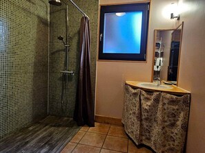 A bathroom with a shower, a sink, a mirror, and a window. - Le Fayard - Chalet with terrace (Mélisey)