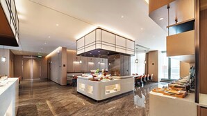 A modern hotel lobby with a central island, seating area, and a large window providing natural light. - MEHOOD LESTIE Hotel(Xi'an Xixian Wuyue Plaza Afanggong South Metro Station Store) (Xi'an)