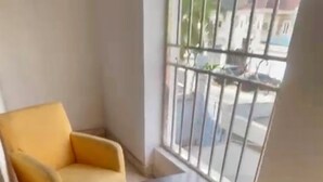 A corner room with two yellow armchairs and a small table. - Weena Hotel & Resort (Lekki)