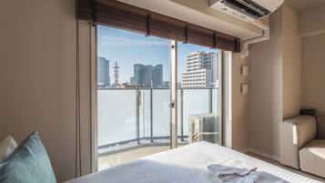 Chambre Signature avec lits jumeaux, 2 lits doubles, balcon, vue sur la ville | Balcon
