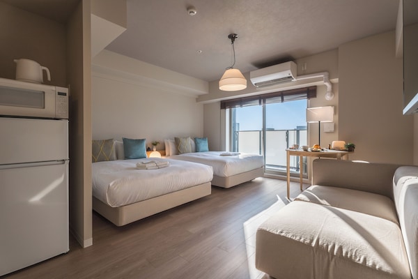 Signature Twin Room, 2 Double Beds, Balcony, City View | Free WiFi, bed sheets