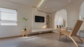 Quarto premium, sacada, vista para a cidade | Área de estar