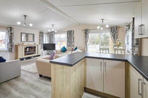 TV, fireplace - Host & Stay | Rowan Lodge (Amotherby)