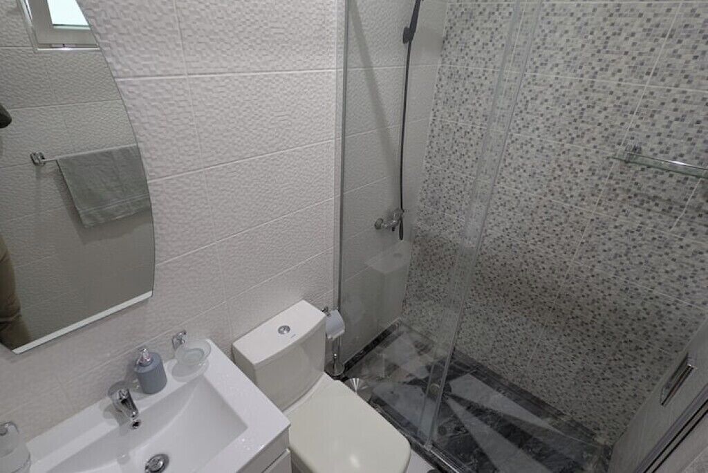 Shower, towels, soap, toilet paper