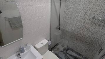 Shower, towels, soap, toilet paper