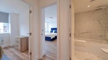 Shower, hair dryer, towels, shampoo