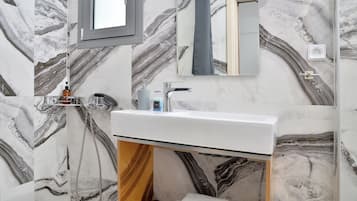 Comfort Studio, Garden View | Bathroom | Hair dryer, slippers, towels, soap