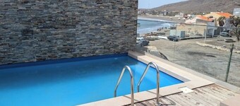 Beachfront Bliss in Praia Baixo – 1Min Walk to Sea