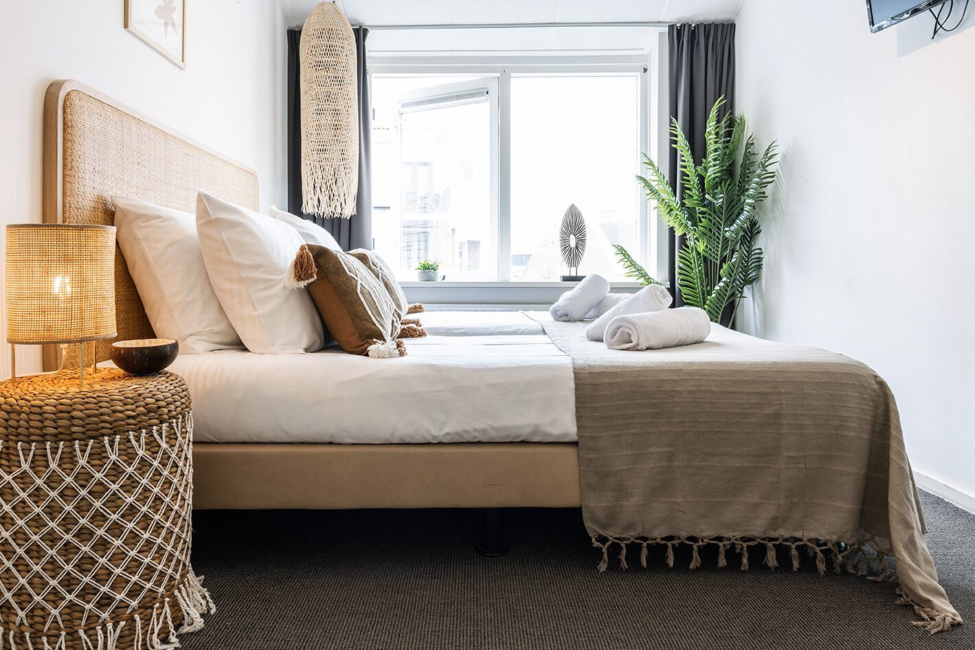 Comfortable bedroom with a soft bed, cozy lighting, and a serene, home-like feel.