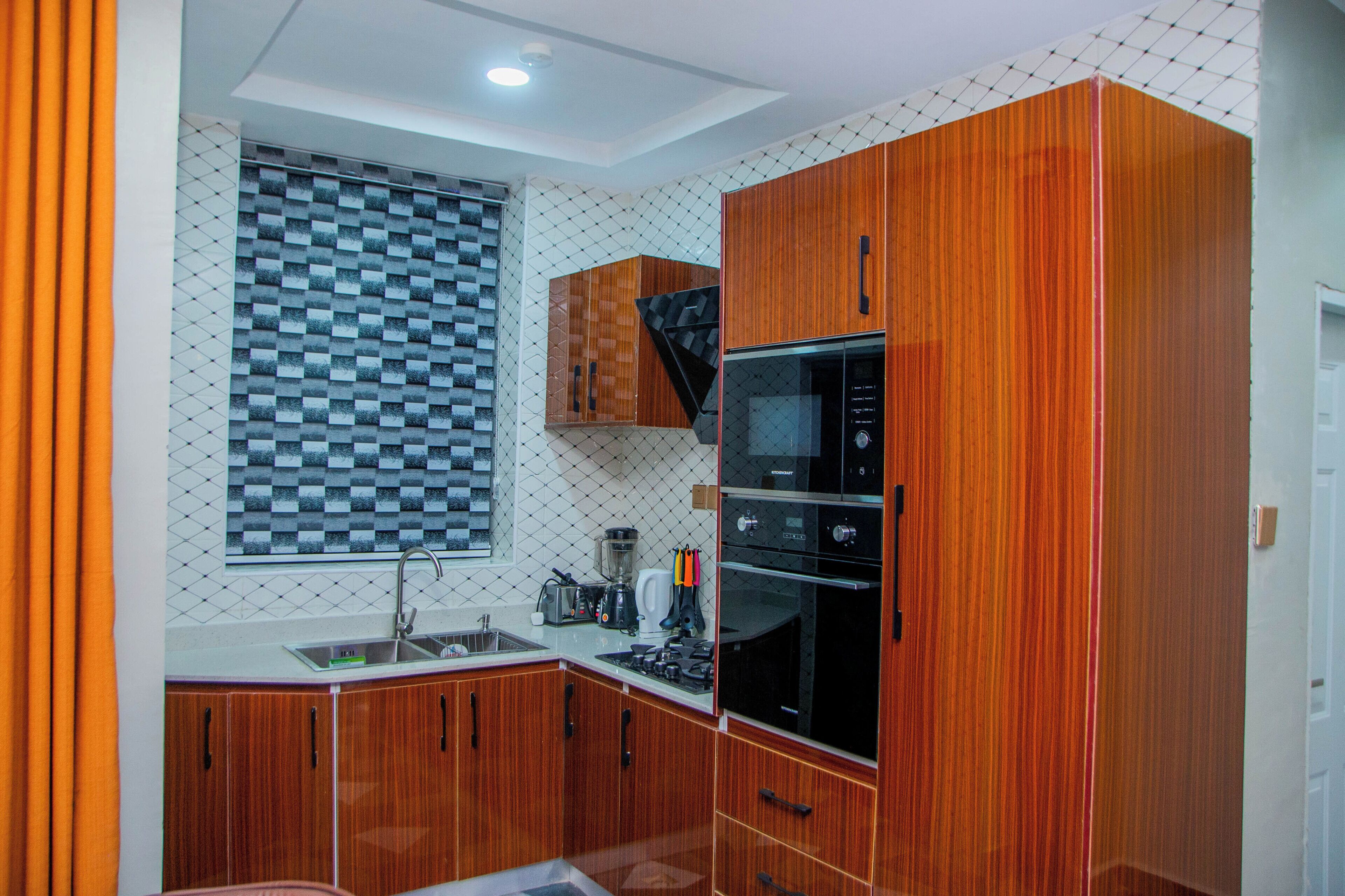 Suíte, 2 quartos | Cozinha privada