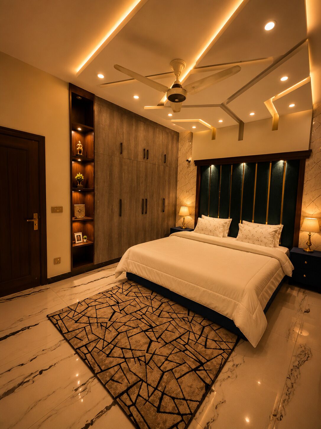 Une chambre à coucher moderne avec un lit, un ventilateur de plafond, une table de chevet et un tapis décoratif.