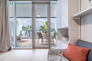 Studio, Terrace | Living area | 32-inch Smart TV with cable channels - Luxury Waterfront Studio Balcony&Parking (Genoa)