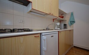 Apartment, 1 Bedroom, Balcony | Private kitchen - Comfortable and Relaxing Vacation Home in Lignano (Lignano Sabbiadoro)