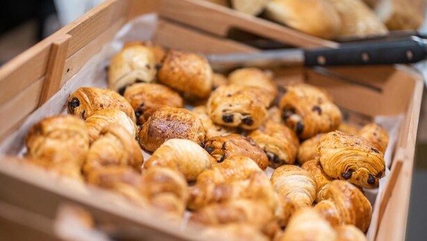 A wooden box filled with assorted pastries. - Amaris Hotel & Spa by Athens Prime Hotels (Athens)