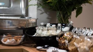 A buffet setup with various food items and containers. - Amaris Hotel & Spa by Athens Prime Hotels (Athens)
