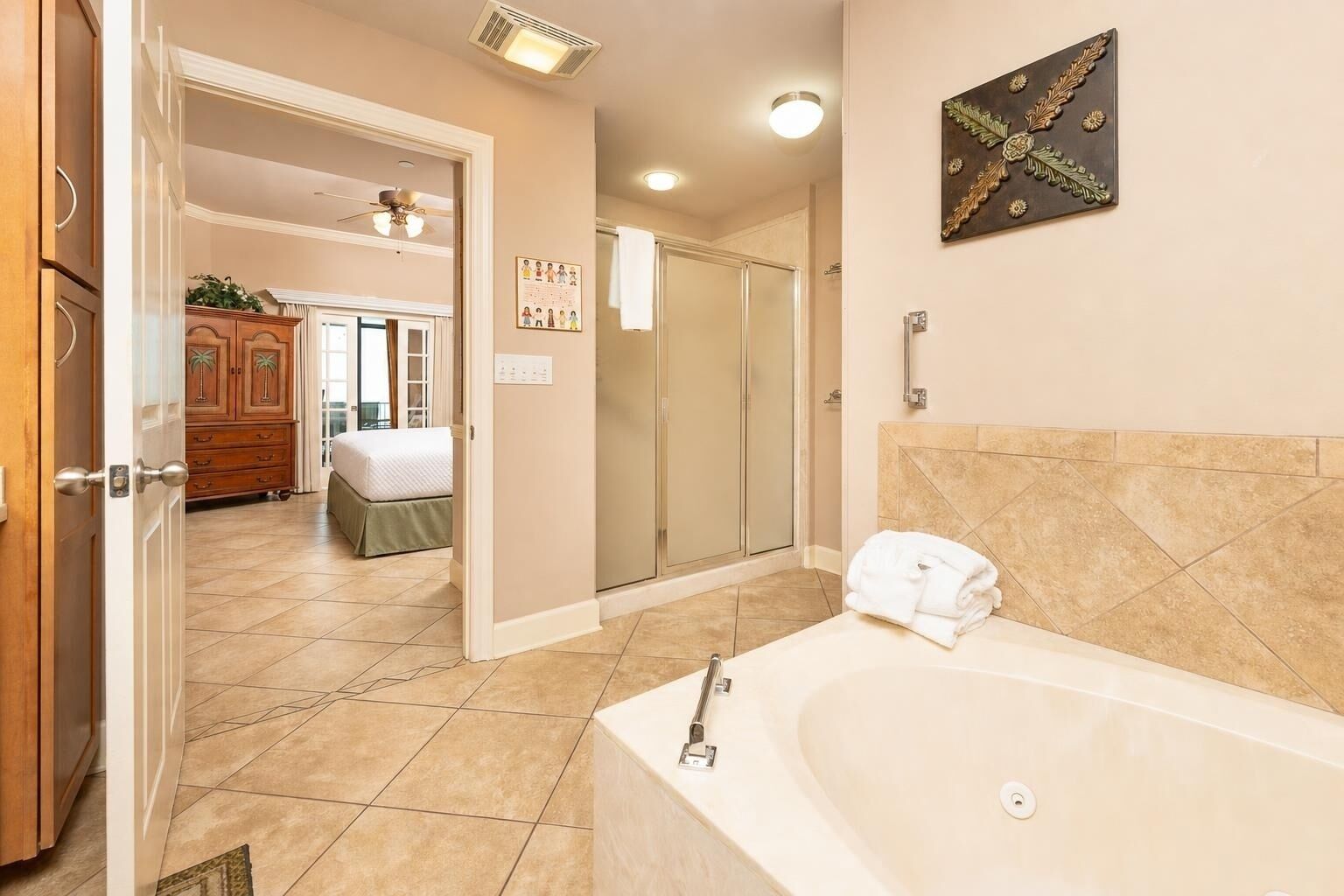 A bathroom with a bathtub, a shower, and a toilet.