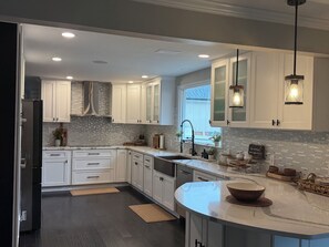 Fridge, microwave, oven, stovetop - 4-bedroom house with beautiful backyard patio perfect for relaxing stays. (Frankford)