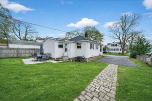 Outdoor dining - Coastal Gem - Charming 3BR Home, Steps to Beach! (Warwick)