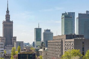 A cityscape with a historic building, modern skyscrapers, and a mix of architectural styles. - Modern Studio in the Center | View of the City | Close to the Theatre (Warszawa)