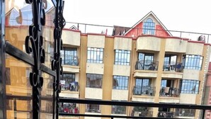 A balcony with a view of a multi-story building with balconies. - Snowhaven Kitengela| Modern, Secure Stay near Town (Kitengela)
