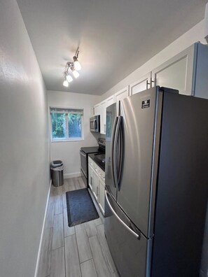 Private kitchen - Beachside Bliss: Beautiful Condo Just Steps from the Sand (Deerfield Beach)