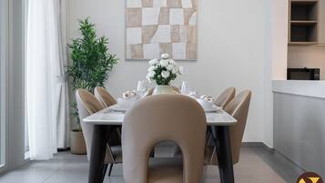 Luxury Apartment, Balcony, City View | In-room dining