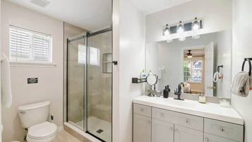 Shower, hair dryer, towels, shampoo