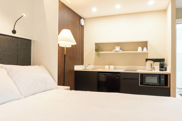 Sleek studio apartment with kitchenette and bathroom