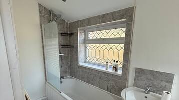 Shower, hair dryer, towels, shampoo
