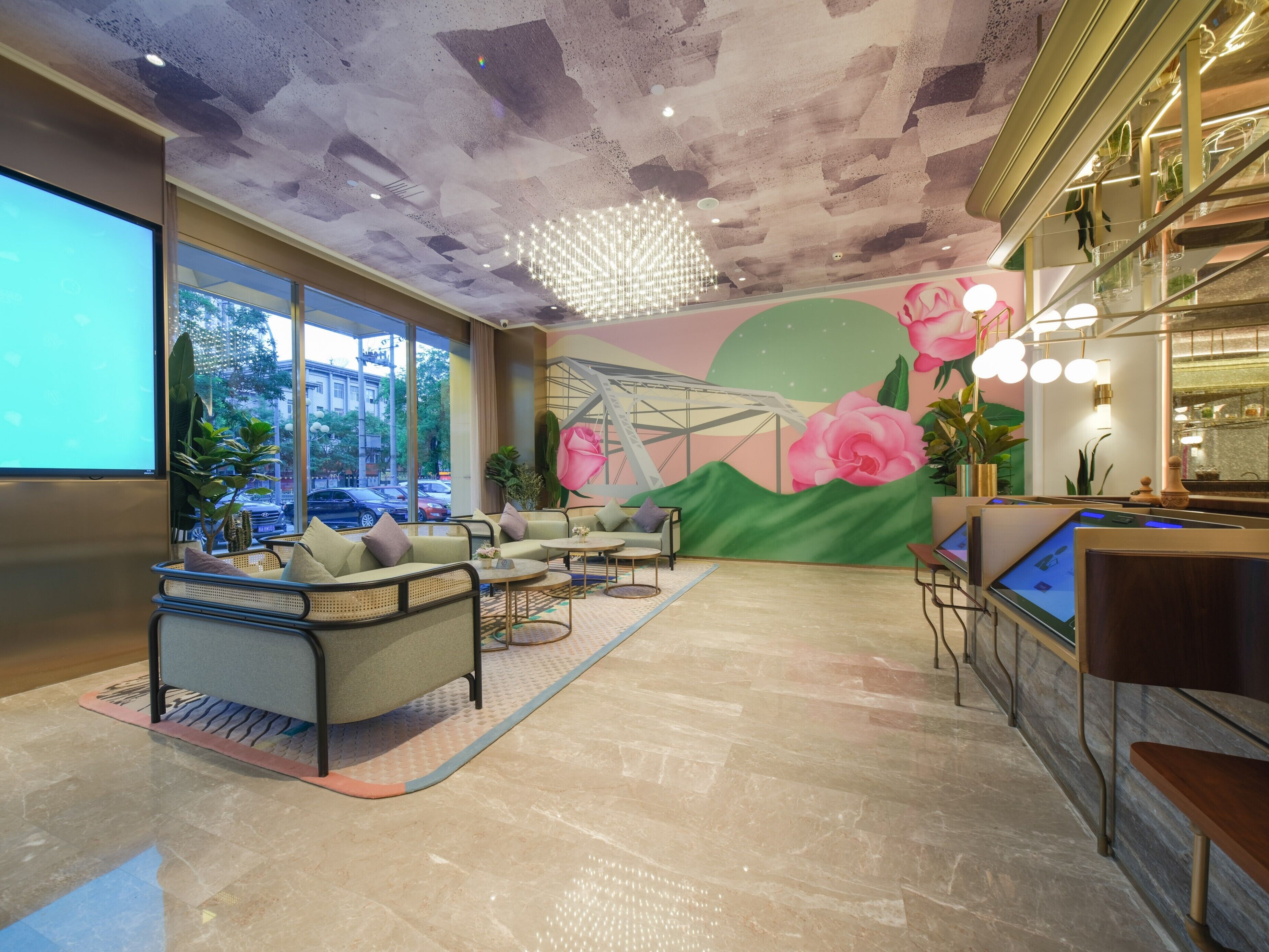 A modern interior with a seating area, a large mural, and a bar area.