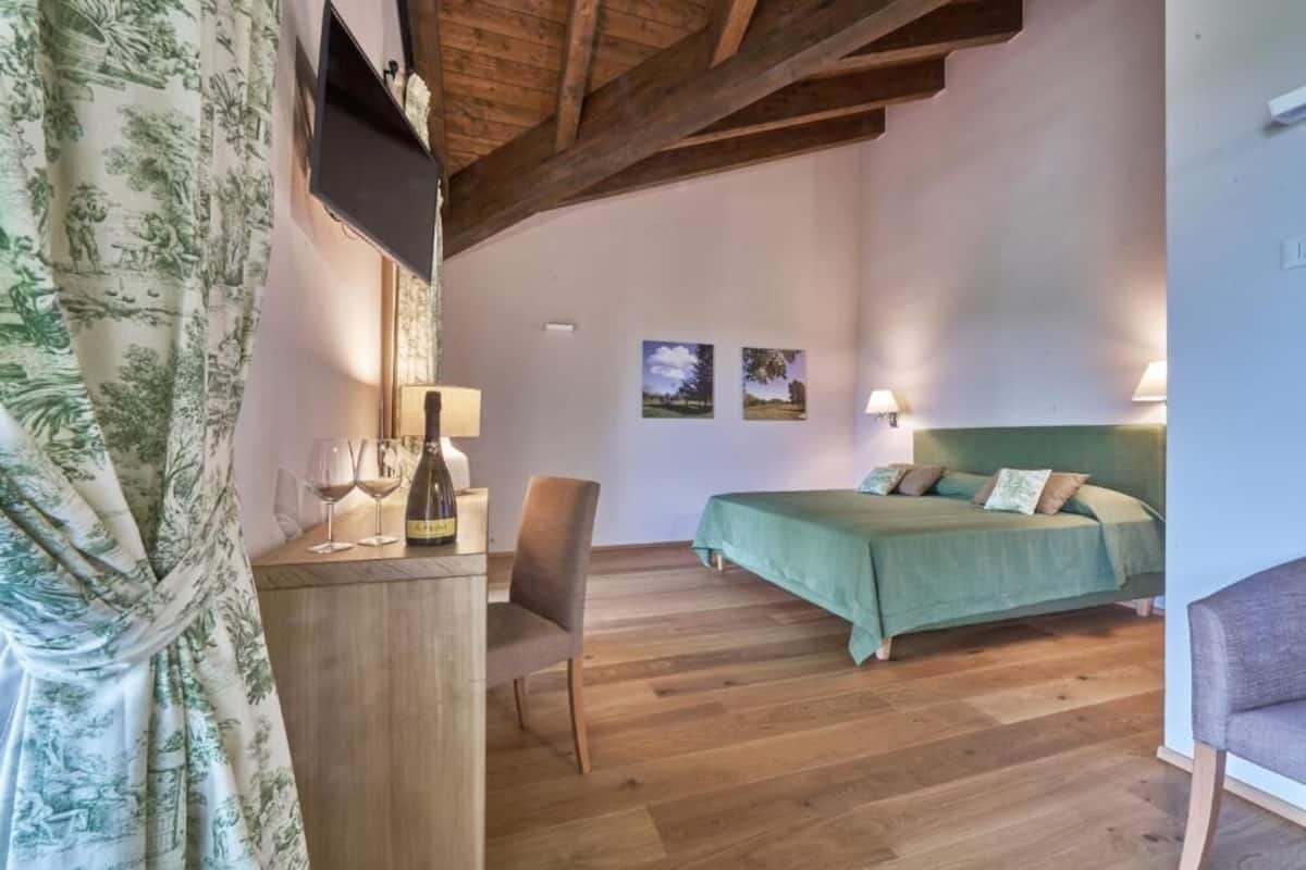 Luxury Triple Room, Balcony, Golf View | Minibar, in-room safe, WiFi (free), bed sheets