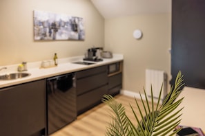Fridge, microwave, stovetop, coffee/tea maker
