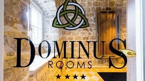 A logo with a trinity knot and the text 'DOMINUS ROOMS' with a five-star rating. - Dominus Rooms  (Dubrovnik)