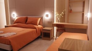 A modern hotel room with a large bed, a desk, and a shelving unit. - L' Angolo sul Mare (Naples)