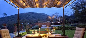 Panorama of Etna and sea, nestled in the park, swimming pool