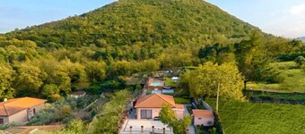 Panorama of Etna and sea, nestled in the park, swimming pool