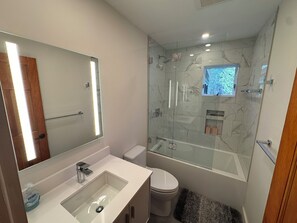 Shower, towels, soap, toilet paper