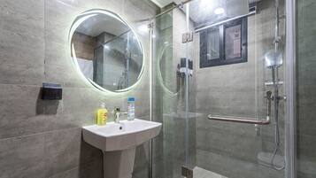 Shower, towels, soap, toilet paper