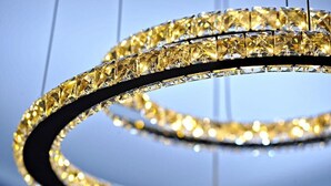A chandelier with multiple tiers of clear, faceted crystals. - Aristonsuite (Piazza Armerina)