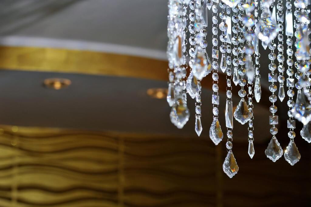 A chandelier with multiple crystal elements.