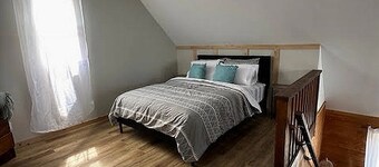 Cozy 2 bedroom Solar Powered Cedar Cottage on the Bay of Chaleur at Charlo NB.