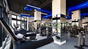 A gym with treadmills, weight machines, and exercise equipment. - Villa La Valencia (San José del Cabo)