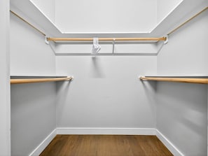 A closet with wooden rods and a hanging rack. - NEW! LUX 3BR w/ 400 Mbps Wifi | ROKU TV & Games! (Boston)