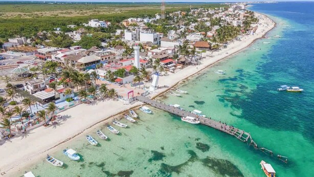 An aerial view of a coastal town with a beach, boats, and a pier. - Rooftop small pool | El Segundo (Puerto Morelos)