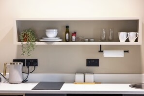 Fridge, microwave, stovetop, coffee/tea maker