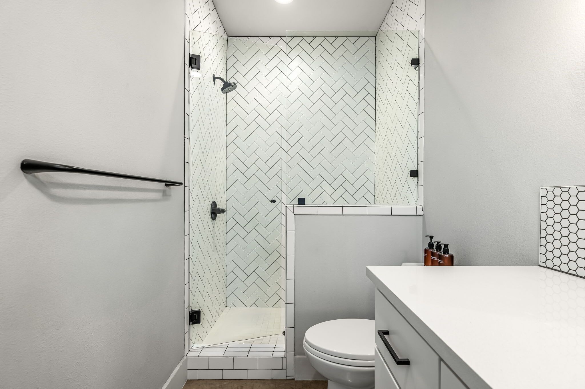 Shower, hair dryer, towels, shampoo