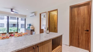 A modern kitchen with a granite countertop, wooden cabinets, and a built-in wine cooler. - Pacific coast retreat w/ kayak, bikes & pool (Tondoroque)