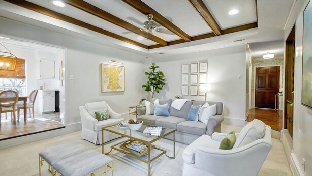 A modern living room with a sofa, armchairs, a coffee table, and a dining area with a table and chairs. - The Coventry — A Family Retreat Near LSU 4BR/2BA w Game Room & Basketball Goal (Baton Rouge)